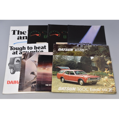 Selection of Japanese and American Showroom Car Brochures including Buick, Pontiac, Daihatsu, Datsun, and Honda