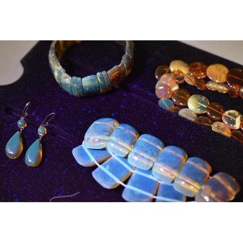 201 - A Selection of Amber Jewellery To Include Two Bracelets, Amber Disc Necklace, And Two Pairs of Earri... 