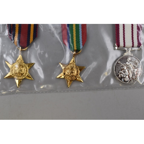 242 - Three Re-Strike Miniature Medals (Burma Star, Pacific Star & Naval Long Service)