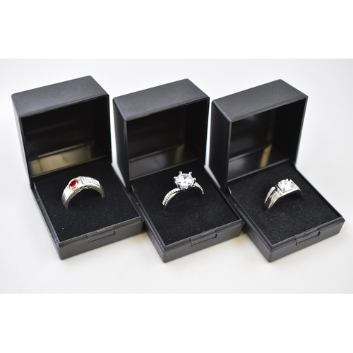 92 - Three Silver 925 Cl and Red Stoned Rings all complete with Presentation Boxes