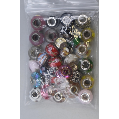 112 - Large Selection of Glass and Metal Charms