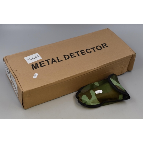 502 - A Tanxunzhe TC-200 Metal Detector (Powers On), With A Foldable Trowel