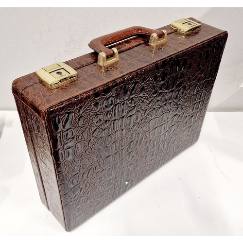 488 - Crocodile Skin Style Brief Case Full of Audio Cassettes includes loads of oldies.