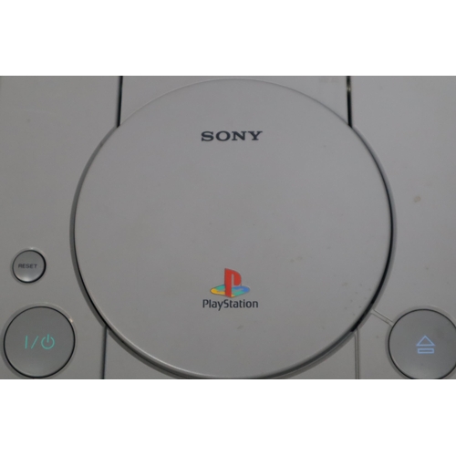 572 - Playstation 1 with 3 Dual Shock Controllers and Original Box (Powers On When Tested)