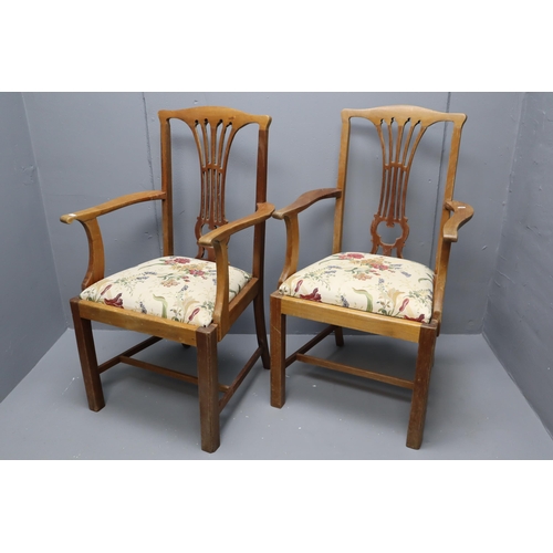 574 - Two Carver arm chairs in light wood with floral upholstery (41