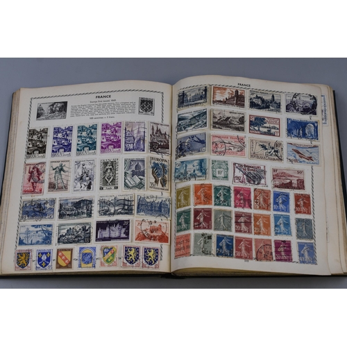 153 - The Triumph Stamp Album containing a Large Selection of GB and Worldwide Stamps Dating From Queen Vi... 