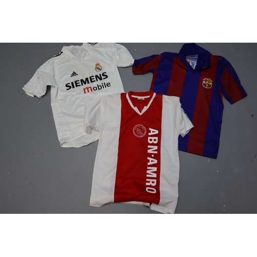 579 - Three Football Shirts including Ajax, Real Madrid and Barcelona