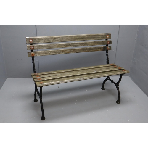 605 - wrought iron and wooden bench (42