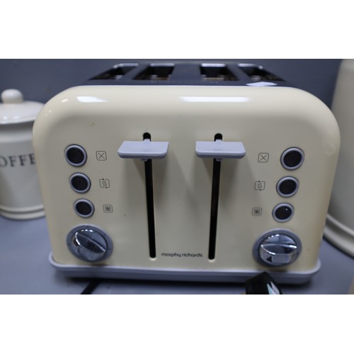 823 - A Morphy Richards four slice toaster & Tea, coffee, sugar caddis & biscuit and bread bin in ... 