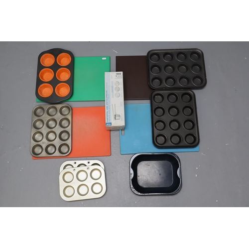 804 - TCM potato press, 4 coloured chef boards plus baking/muffin tins