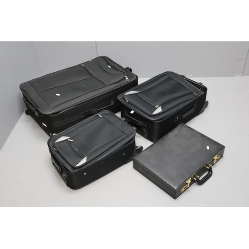 845 - Three black matching suit cases largest 29