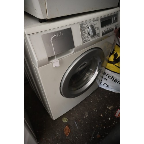 594 - AEG L14850 Washer Dryer, 7kg wash/5kg dry load, C energy rating, 1400rpm spin, white. NO POSTAGE ON ... 