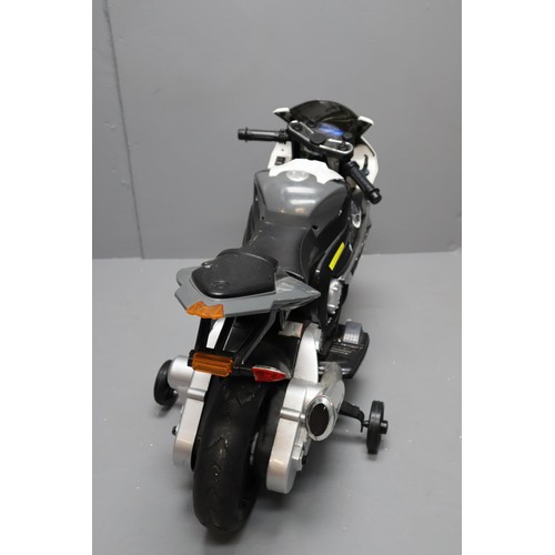 626 - Child's BMW Battery Powered Motorbike with stabilisers Fitted untested item no charger present. NO P... 