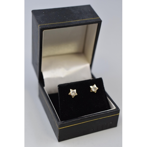 69 - Pair of unmarked tested 9ct Gold Star Earrings Complete with Presentation Box