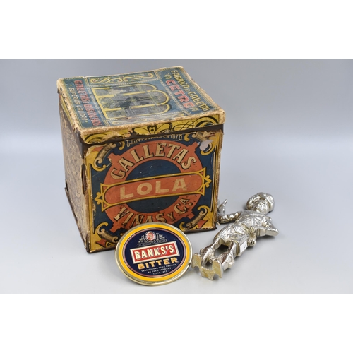 377 - Small mixed lot to include: Vintage Spanish biscuit tin, A Scotch whiskey figurine and A Banks's bit... 