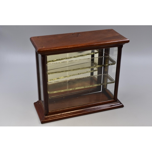 389 - Small antique jewelers display cabinet in dark wood with glass shelves and brass fittings with door ... 