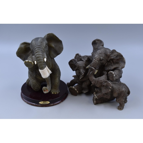 353 - Two resin elephant ornaments tallest 7