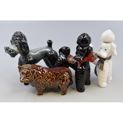 367 - Four Vintage Statues to include Three poodles (2 are Rynbende Brandy Decanters 1 with Contents) and ... 