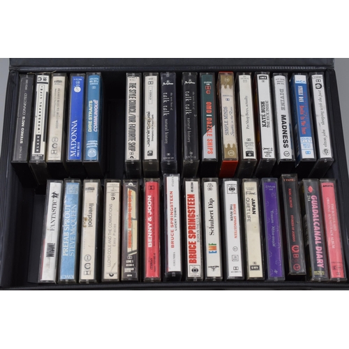 494 - Selection of 31 cassette tapes in carry case to include Bruce Springsteen, Madonna, OMD, Japan, talk... 