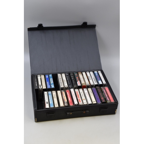 494 - Selection of 31 cassette tapes in carry case to include Bruce Springsteen, Madonna, OMD, Japan, talk... 