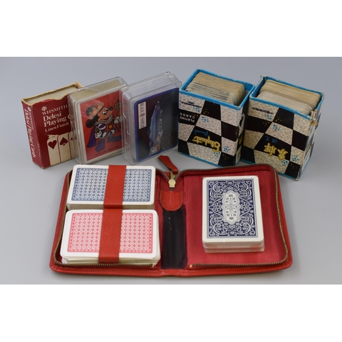 506 - Collection of 6 packs of playing cards including Walt Disney and black watch decks plus loads of ext... 