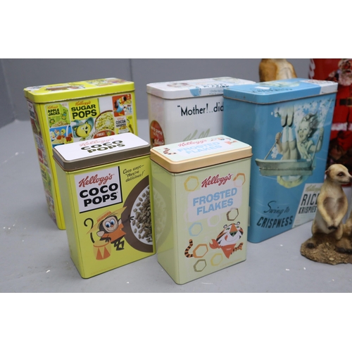 927 - Mixed Lot Including Collectible Cereal Promotional Tins, Meerkat Figurine and More