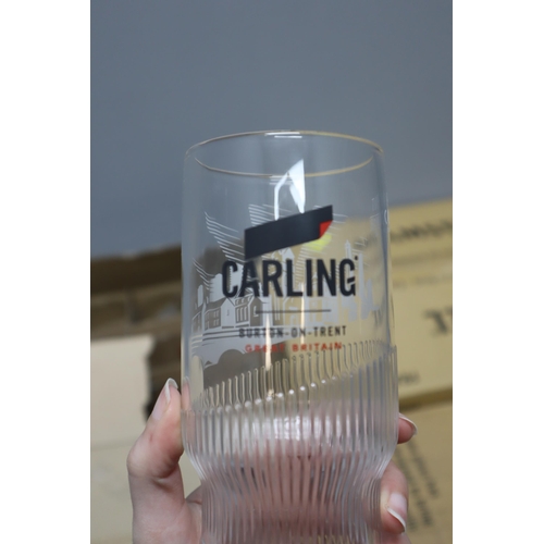 602 - Large Selection of Branded Beer Glasses including Amstel, Carling, and Unicorn