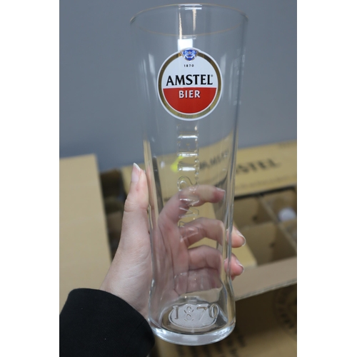 602 - Large Selection of Branded Beer Glasses including Amstel, Carling, and Unicorn