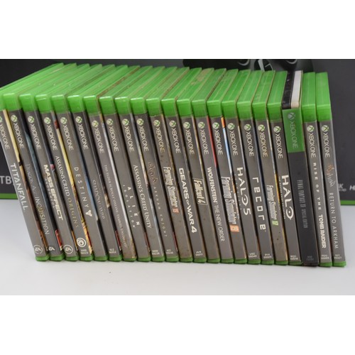 605 - Xbox One in black 1TB (boxed) with 22 games all boxed.