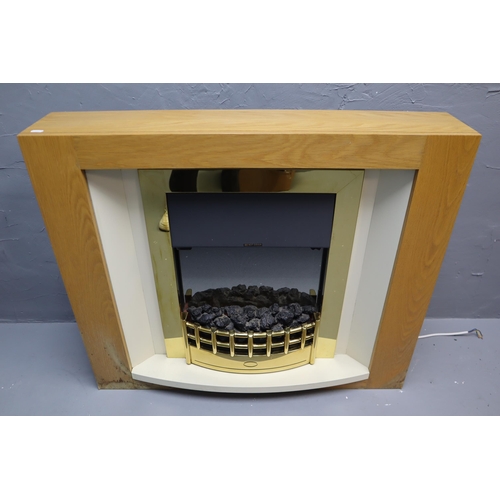 757 - Electric fire with in black and brass effect and pine effect surround 32