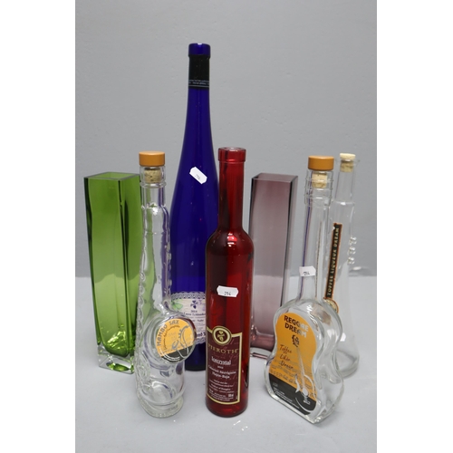 872 - A Selection of Five Empty Collectable Alcohol Bottles and Two Coloured Vases. Includes Mambo Sax, Re... 