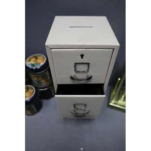 894 - Metal Filing Cabinet themed Money Box with Key, Quartz Mantle Clock and a Set of 5 Decorative Tins