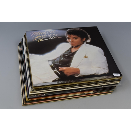 497 - Sixteen Vinyl LP's including Michael Jackson Thriller, Boney M, Shakin Stevens, Wham, Tom Jones, Elv... 