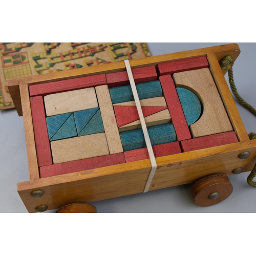 347 - Vintage childs wooden building block set in cart with original lid, 13