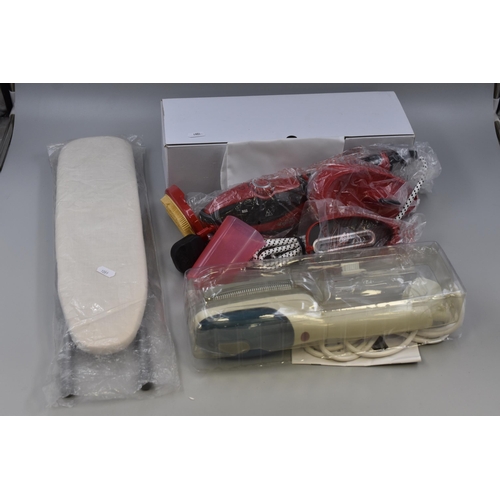 518 - Two Handheld Steam Cleaners, With Miniature Ironing Board. Both Power on When Tested