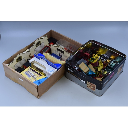 539 - Two boxes of collectables and playworn vehicles to include: A Warburtons die-cast model, 1909 Thomas... 