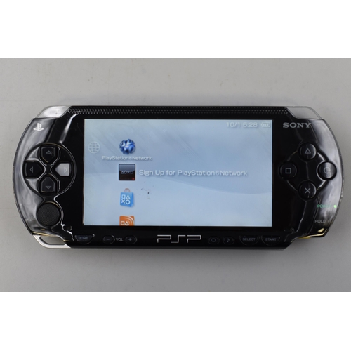 403 - A Sony PSP Handheld Console With Case and Charging Cable. Unable To Read Discs But Can Still Play Do... 