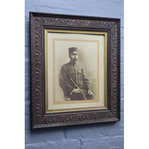 424 - Vintage picture showing a military soldier in a dark wooded floral embossed frame (28