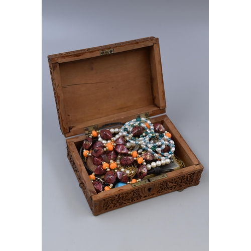 458 - Unsorted Jewellery In Wooden Hand Carved Box (As Found)