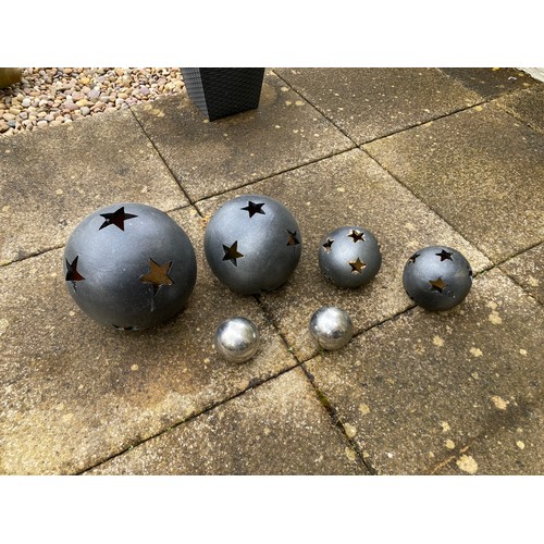 852 - Selection of garden ornament balls to include 4 black terracotta with star shaped holes (large hole ... 