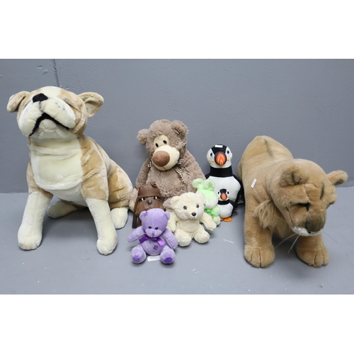 806 - A selection of teddy bears to include: A puffin doorstop, dog, lion and more