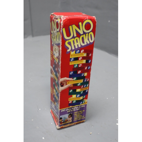 817 - A Large Selection of Childrens Toys To Include Uno Stacko, Chess Set (Unchecked), Nerf Gun, And More