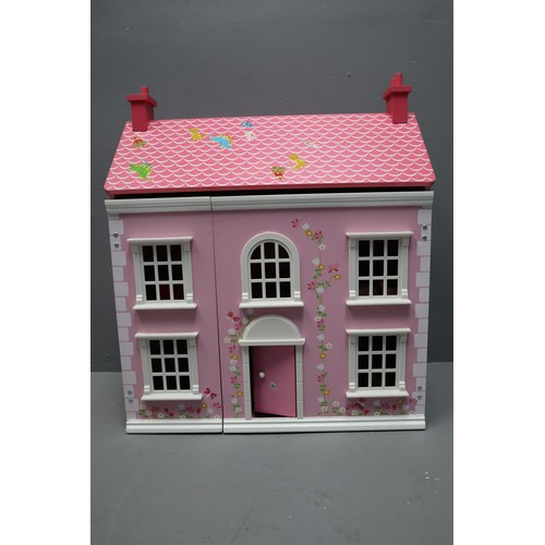 798 - Child's Pink Wooden Dolls House Complete with Furniture and Little People 23