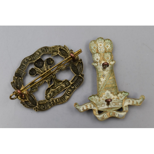 263 - Two Military Cap Badges including South Lancashire Prince of Wales Volunteers and The 11th Hussars P... 
