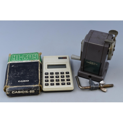 217 - Two Vintage Items to include a Vintage Velos Solo 555 Pencil Sharpener and a Boxed Casio HL-809 Elec... 