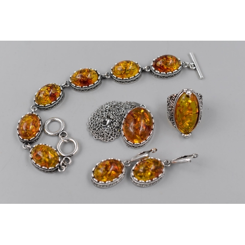 228 - A Set of Silver Plated Amber Jewellery, Includes Bracelet, Ring, Earrings, And Necklace Pendant