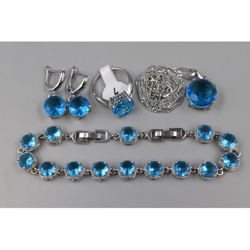 54 - A 925. Silver Blue Topaz Stoned Jewellery Set (Bracelet, Ring, Earrings, And Pendant Necklace)