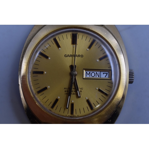 101 - A Garrard Automatic 25 Jewels Day/Time Watch, Given Leyland Motors Employee. With Original Box, In W... 