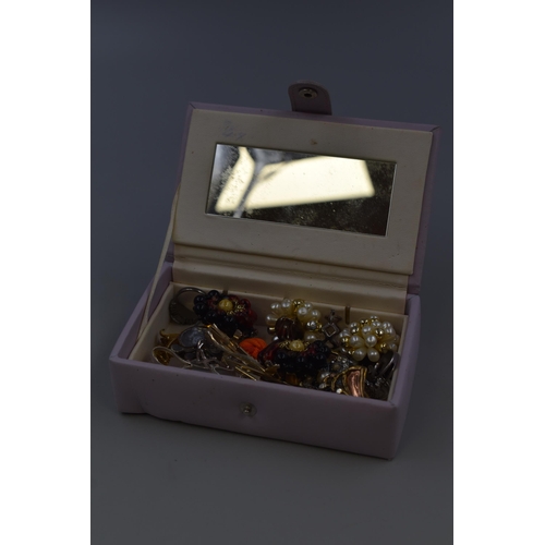 125 - Small lilac jewellery box with unsorted jewellery inside