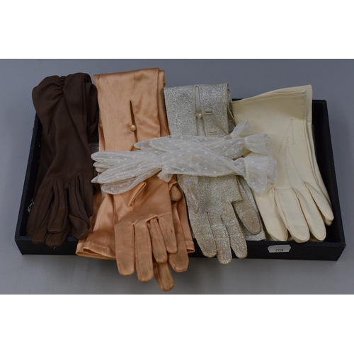 130 - Three pairs of ladies long dress gloves, a pair of cream leather gloves, a pair of white net gloves,... 